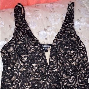 A cute black lace dress .